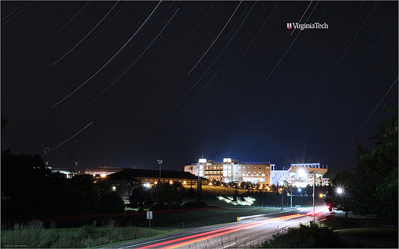 Star trails behind Lane Stadium. Virginia Tech.